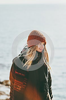 Young Woman walking at winter seaside Travel Fashion Lifestyle concept outdoor