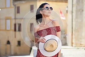 Young woman walks around the city