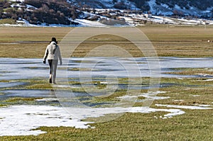 Young woman walks in the mountain in Italy