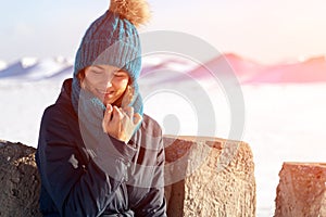 A young woman in warm coat