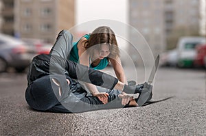 Young woman was attacked by armed thief and is fighting and defending herself.