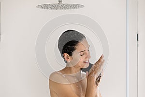 Young woman wash hair with natural shampoo