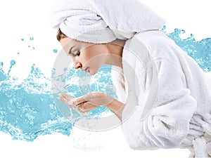 Young woman washing face with clean water.