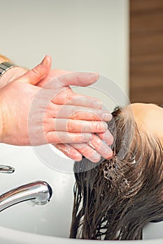 Young woman washing her hair