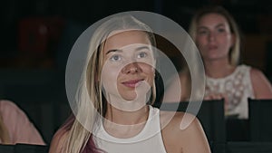 Young woman watch film in the cinema