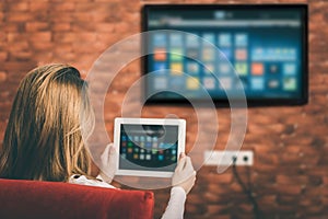 Young woman watching smart TV.