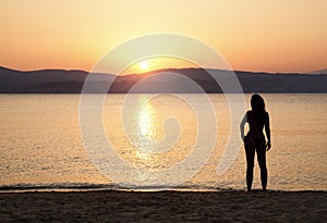 Young woman watching sunset