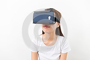 Young woman watching though the VR device