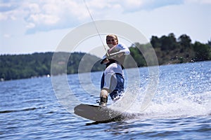 A young woman water skiing