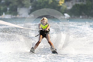 A young woman water skiing.