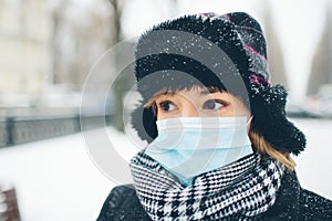 Young woman wear face mask for sickness coronavirus protection. Portrait of serious calm and peaceful female person