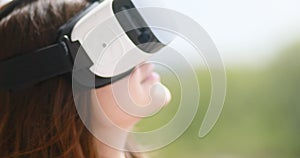 Young woman wear virtual reality digital glasses device, happy smiling beautiful girl vr technology entertainment video