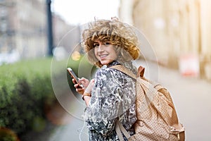 Young woman wearing backpack