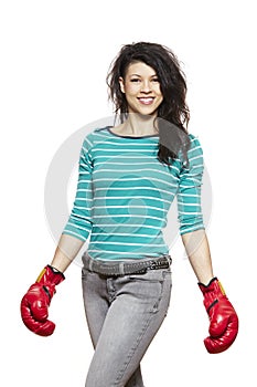 Young woman wearing boxing gloves smiling