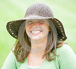 Young Woman Wearing a Brown Hat