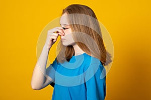 Young woman wearing casual clothes tired rubbing nose and eyes feeling fatigue and headache. Stress and frustration concept