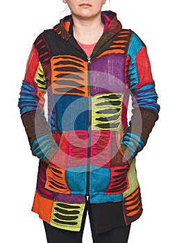 Young woman wearing coat of many colors hooded long patchwork jacket