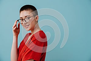 Young woman wearing eyeglasses smiling and looking at camera