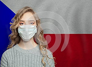Young woman wearing a face mask with national flag Czech Republic. Flu epidemic and virus protection concept