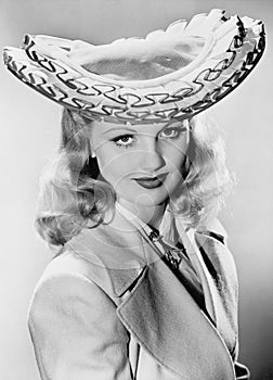 Young woman wearing her exotic hat
