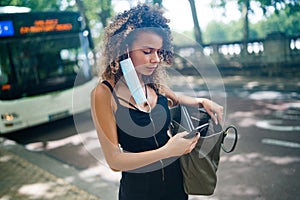 Young woman wearing her mask inappropriately during virus pandemic