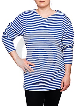 Young woman is wearing long sleeved telnyashka russian navy striped shirt