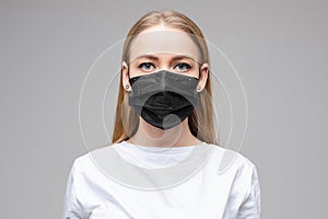 Young woman is wearing medical face mask