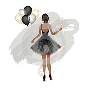 Young woman wearing party dress holding a glass of champagne and balloons. photo