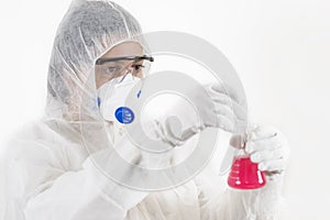 Young Woman wearing protective suit holding some laboratory glassware