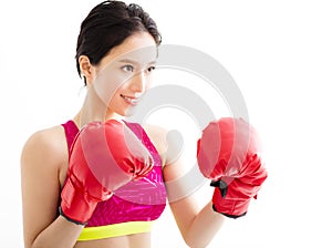 young woman wearing red boxing gloves