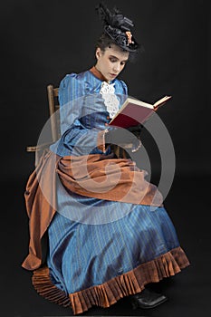 A young woman wearing an 1880s Victorian costume