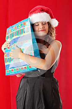 Young woman wearing santa claus hat