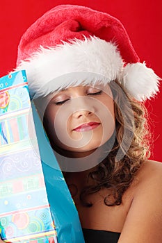 Young woman wearing santa claus hat