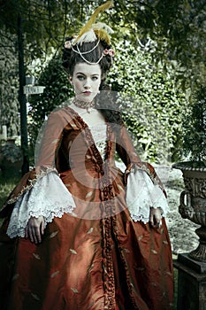 A young woman wearing a a silk Georgian robe a la Francaise