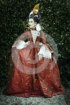 A young woman wearing a a silk Georgian robe a la Francaise photo