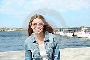 Young woman wearing stylish sunglasses