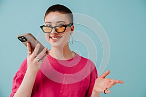 Young woman wearing sunglasses talking on cellphone