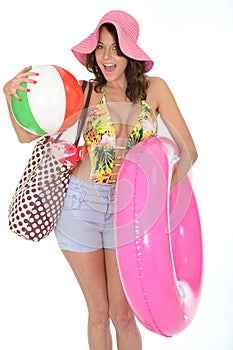 Young Woman Wearing a Swim Suit on Holiday Carrying a Beach Items