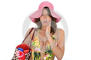 Young Woman Wearing a Swim Suit and a Pink Straw Hat on Holiday