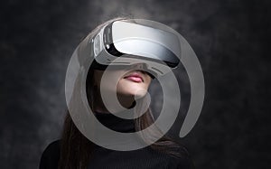 Young woman wearing virtual reality glasses