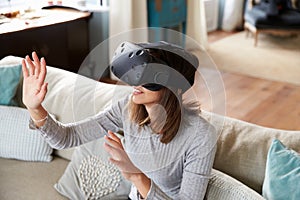 Young Woman Wearing Virtual Reality Headset In Studio