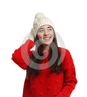 Young woman wearing warm clothes on white background