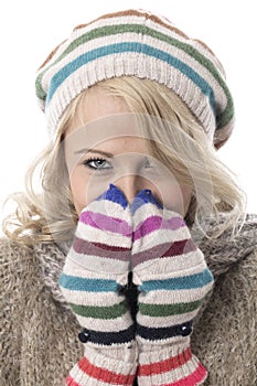 Young Woman Wearing a Wooly Hat and Gloves