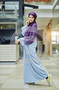 Young Woman Wears Fashionable Traditional Arabic Clothing. Religion and Fashion
