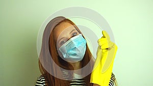 Young woman wears protective white medical mask ,puts on medical gloves, preparing for coronavirus epidemic