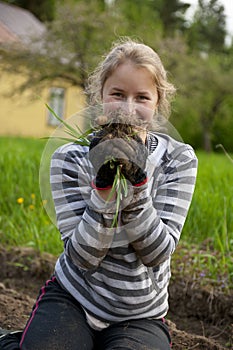Young woman weeding tillage photo