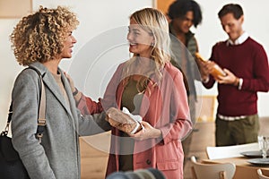 Young Woman Welcoming Guests for Party
