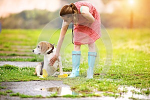 Young woman in wellies walk her dog photo