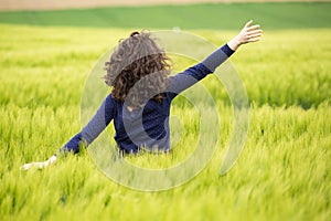 Young woman in wheat field