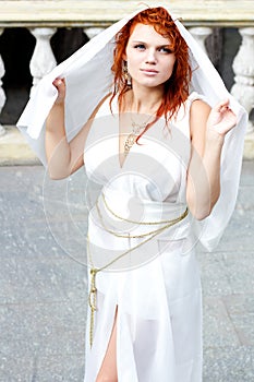 Young woman in white antique dress